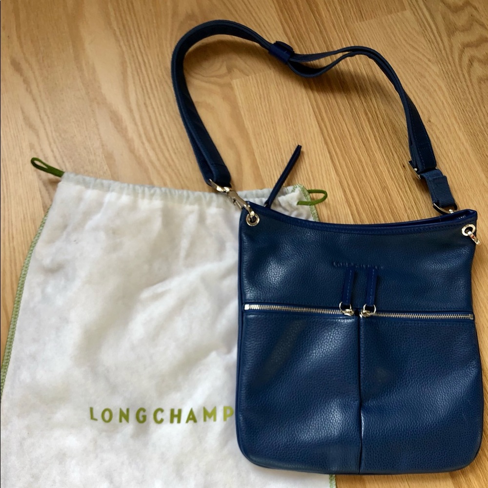 Lovely Blue Longchamp pebbled leather crossbody bag with adjustable strap.